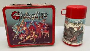 lot 243 image: 1985 Aladdin Industries (Thundercats) Embossed Metal Lunch Box With Thermos (Handle Missing)