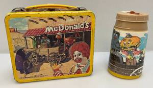 lot 244 image: 1982 Aladdin Industries (Ronald Mcdonald Sheriff Of Cactus Canyon) Embossed Metal Lunch Box With Thermos  (Writing Present)