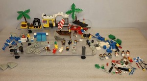 lot 101 image: Vintage LEGOS PartsSetsLEGO 6260 Shipwreck Island, Pirates Lagoon Lockup 6267, Space Supply Station 6930 Etc.