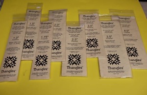 lot 147 image: (6) Quilting Template SetsThangles 1-4 Inches