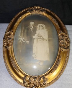 lot 216 image: Antique Wedding Bride Groom Portrait Early 1900s Solid Hand Carved Wood Frame wDomed Convex Glass Golden-Bronze Ornate Large Heavy 24 Picture and Frame