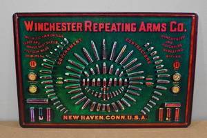 lot 98 image: Metal Novelty Sign -Winchester Repeating Arms Co