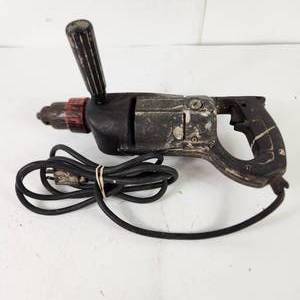 lot 12 image: Corded Hammer Drill Not Sure Of Brand Tested Works Good Condition