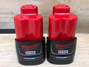 lot 121 image: Lot of 2 - Milwaukee M12 Red Lithium 2Ah Batteries Model # 48-11-2420