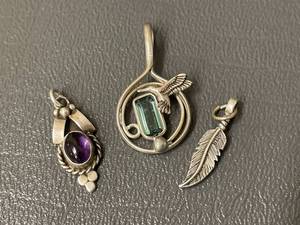 lot 41 image: Unique Silver Pendants Set with Gemstones and Artistic Designs