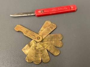 lot 74 image: Vintage Western Auto Brass Key Gauge & AP Promo Knife