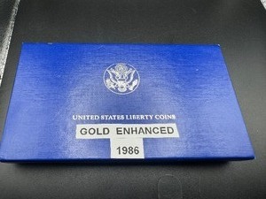 lot 61 image: 1986 Gold Enhanced Tri Color Gold Statue of Liberty Commemorative Collectible Coin 1.22 oz Silver