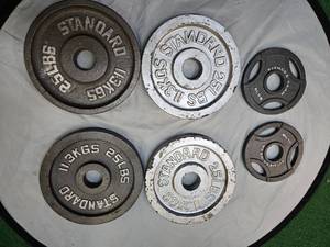 lot 24 image: Lot of Four 25Lbs 2 Weight Plates and Two 5Lbs 2 Weight Plates (Total of 110LbS)
