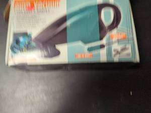 lot 59 image: Used Compact Handheld Vacuum Cleaner with Accessories