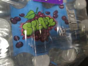 lot 105 image: Pack of 24 Splash Grape Flavored Drinks - 11.5 oz Bottles