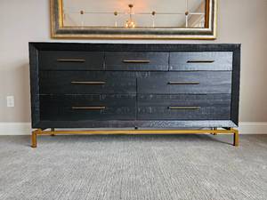 lot 1 image: West Elm Alexa Burnished 7-Drawer Dresser Features Black Stain finish and Brass Floating Base & Drawer Pulls