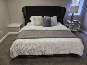 lot 39 image: Black Velvet King Platform Bedframe Featuring Wingback with tufted details & Silver Tac