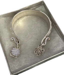 lot 206 image: Silver plated bangle with Hmong inspired charms