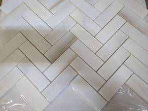 lot 44 image: 2 Boxes of Herringbone Polished Backsplash Tiles