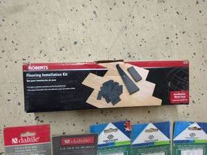 lot 65 image: Roberts Flooring Installation Kit and 5 4pc 12 x 12 Jolly Ceramic Wall Tile Trim Pieces