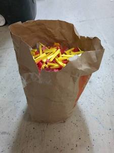 lot 114 image: Paper Grocery Bag of Random Tile Leveling Clips