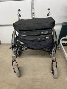 lot 15 image: Invacare Tracer IV Wheelchair with Mixed Brand Used Seat Cushions - In Good Condition