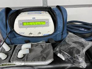 lot 5 image: Hill-Rom 105 The Vest Airway Clearance System with Manual, Wraps, Tubing, NEW Childs Medium Vest and Carry Bag - In Great Working Condition