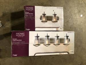 lot 10 image: Lot of Home Decorators Collection Georgina 18 in. 2-Light Weathered Iron Industrial Rustic Vanity and 30 in. 4 Light Weathered Vanity Customer Returns