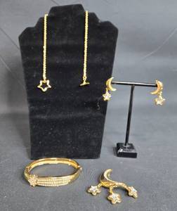 lot 32 image: Gold Tone Plated Jewelry Set with Star and Moon Design - Necklace, Earrings, Bracelet, and Brooch - displays not included