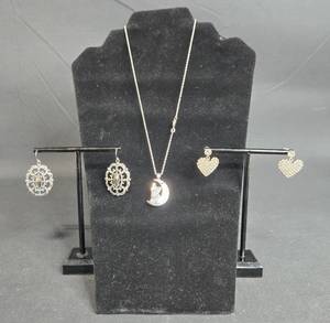 lot 38 image: Set of 3 Silver Tone Jewelry Pieces - Necklace with Crescent Moon and 2 Pairs of Earrings - displays not included