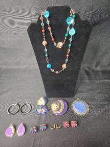 lot 62 image: Assorted Jewelry Collection Including Necklaces, Earrings, and Pins - displays not included