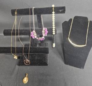 lot 211 image: Collection of Unique Necklaces Inc Jennifer Lopez & A Cameo Pendant  - Displays not included