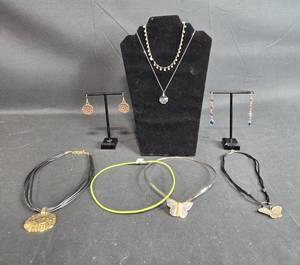 lot 135 image: Lot of 6 Unique Necklaces and Earrings - Includes Butterfly, Beaded, and Modern Designs - displays not included