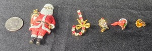 lot 101 image: Collection of 5 Christmas-Themed Brooches Including Santa and Holiday Accents