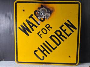 lot 93 image: Watch for Children Traffic Safety Sign with Visible Damage