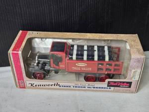 lot 113 image: 134 Scale Kenworth Stake Truck Coin Bank with Barrels by Ertle