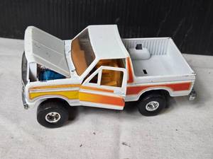 lot 133 image: Vintage Ford Pickup Truck Diecast Model with Opening Hood and Doors by Ertl