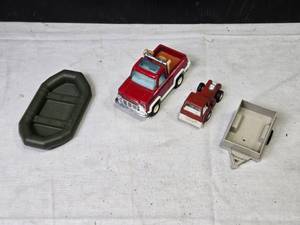 lot 136 image: Lot of Vintage Toy Vehicles - Pickup Truck, Red Tractor, Trailer, and Inflatable Boat