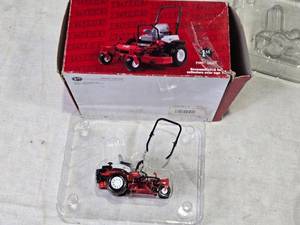 lot 160 image: Limited Edition 124 Scale Exmark Lazer Z X-Series Riding Mower Die-Cast Metal Replica - Roll Bar is Broken