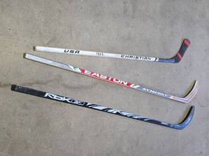 lot 209 image: Lot of 3 Ice Hockey Sticks - Easton, Christian, and RBK