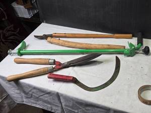 lot 228 image: Collection of Gardening Tools Including Weed Cutter, Pruning Shears, and Hand Tools