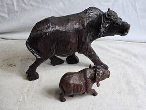 lot 366 image: Set of 2 Handcrafted Dark Brown Wooden Buffalo Figurines