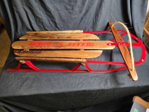 lot 1A image: Beautifully Restored Red Metal and Wood Snow Sled with Rope Handle