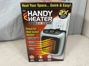 lot 80 image: New Handy Heater Turbo Heat Outlet Mounted Space Heater