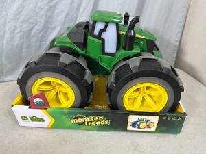 lot 107 image: New Monster Treads John Deere Tractor