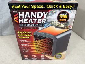 lot 230 image: New Handy Heater Pure Warmth Ceramic Space Heater with LED Lights