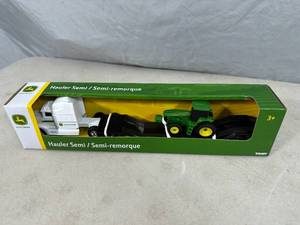 lot 322 image: New John Deere Semi Truck Hauler and Tractor Toy