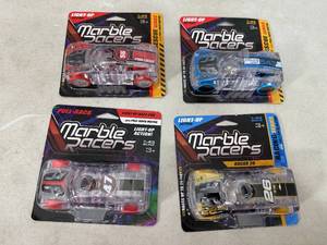 lot 364 image: 4 New Marble Racers Light Up Pull-Back Toy Cars