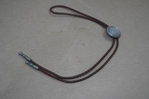 lot 119 image: Vintage Bolo Tie with 1964 Kennedy Half Dollar