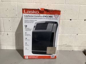 lot 551 image: Lasko 1500W Cyclonic Ceramic Console Electric Space Heater with Timer
