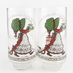 lot 35 image: HOLLY HOBBIE Set of 2 COCA-COLA &nbspLimited Edition Christmas Glasses Christmas is love with all the trimmings