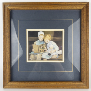 lot 59 image: NANCY NOEL The Silver Tail Two Amish Girls Reading Book -Framed