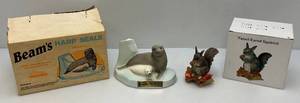 lot 104 image: Jim Beam Collectible Harp Seal Decanter & Ski Country Tassel-Eared Squirrel