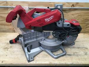 lot 14 image: Milwaukee 12 Sliding Compound Miter Saw Model # 6955-20