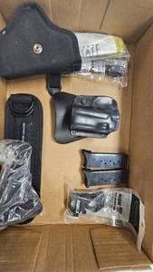 lot 151 image: Ruger EC9 Mags,holsters, and scope rings